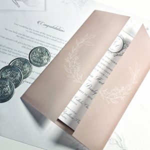 blush pink vellum wedding invitation sleeve wax seal.png