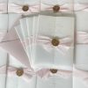 Venetian-pink-vellum wedding invitation