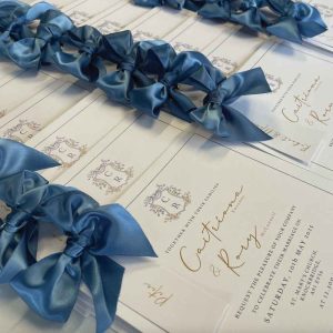 the Warrington wedding invitation vintage blue ribbon and guest name tag