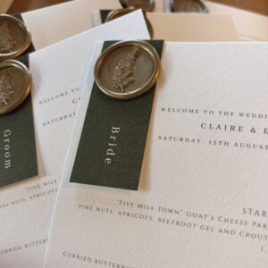 Olive-green-tag-wax-seal-wedding-menu-closeup